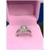 Image 1 : GRA CERTIFIED MOISSANITE VVS D APPROX. 1.00 CARAT SET IN CENTER WITH 26 CUBIC ZIRCONIUM SET IN HALO 
