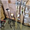 Image 1 : 2 CAST IRON CANDLE STANDS AND 4 NEW TIKI TORCHES