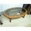 Wood framed oval coffee table with bevelled edge glass top, Approximately 48 inches by 40 inches