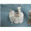 Image 5 : figurines of lady playing piano ( lady is musical ) and boy with baskets