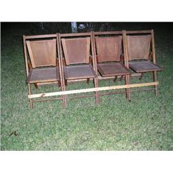 4 wooden theater style chairs