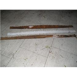 Three old metal cross cut saws