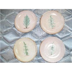 Four pottery plates.