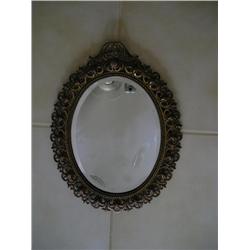 Heavy brass framed beveled mirror