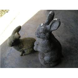Two cement bunny yard statues