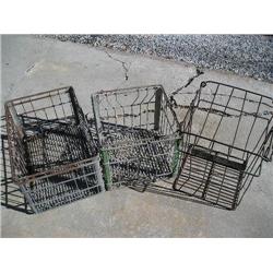 Three metal food crates