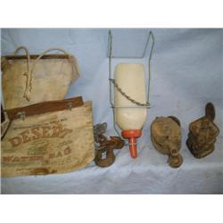 Two old pulleys, canvas water bags, misc