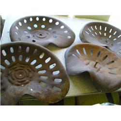 4 old tractor seats