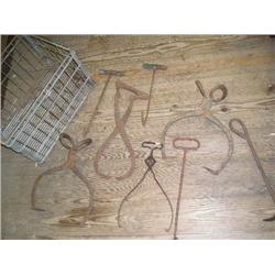 Ice tongs, and hooks in metal crate