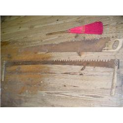 Cross cut saws and old broom