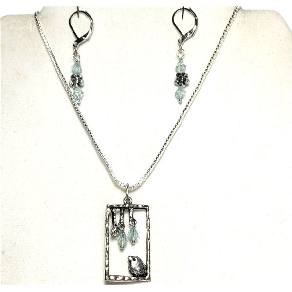 4)  SILVER TONE WITH AQUA COLORED SWAROVSKI