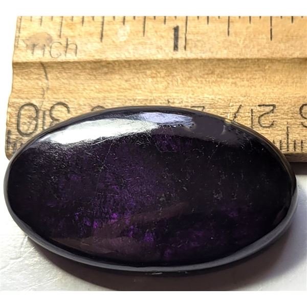 24)  DEEP PURPLE OVAL 79 CT AMMOLITE GEMSTONE