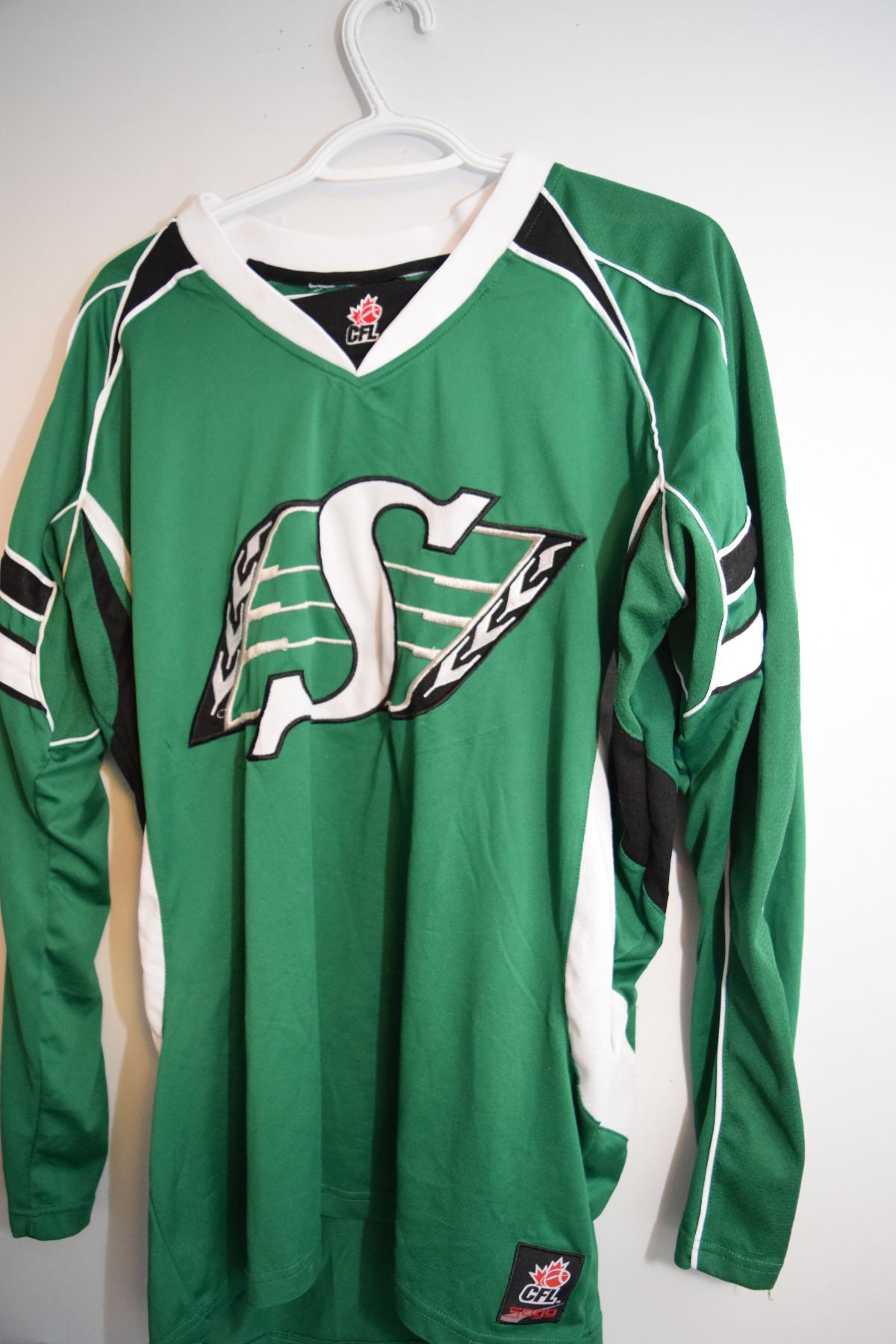 Sask Roughriders large jersey - Schmalz Auctions
