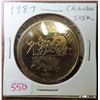 Image 1 : 1987 Craven, Saskatchewan Trade Dollar. Chuck Wagon race. BU