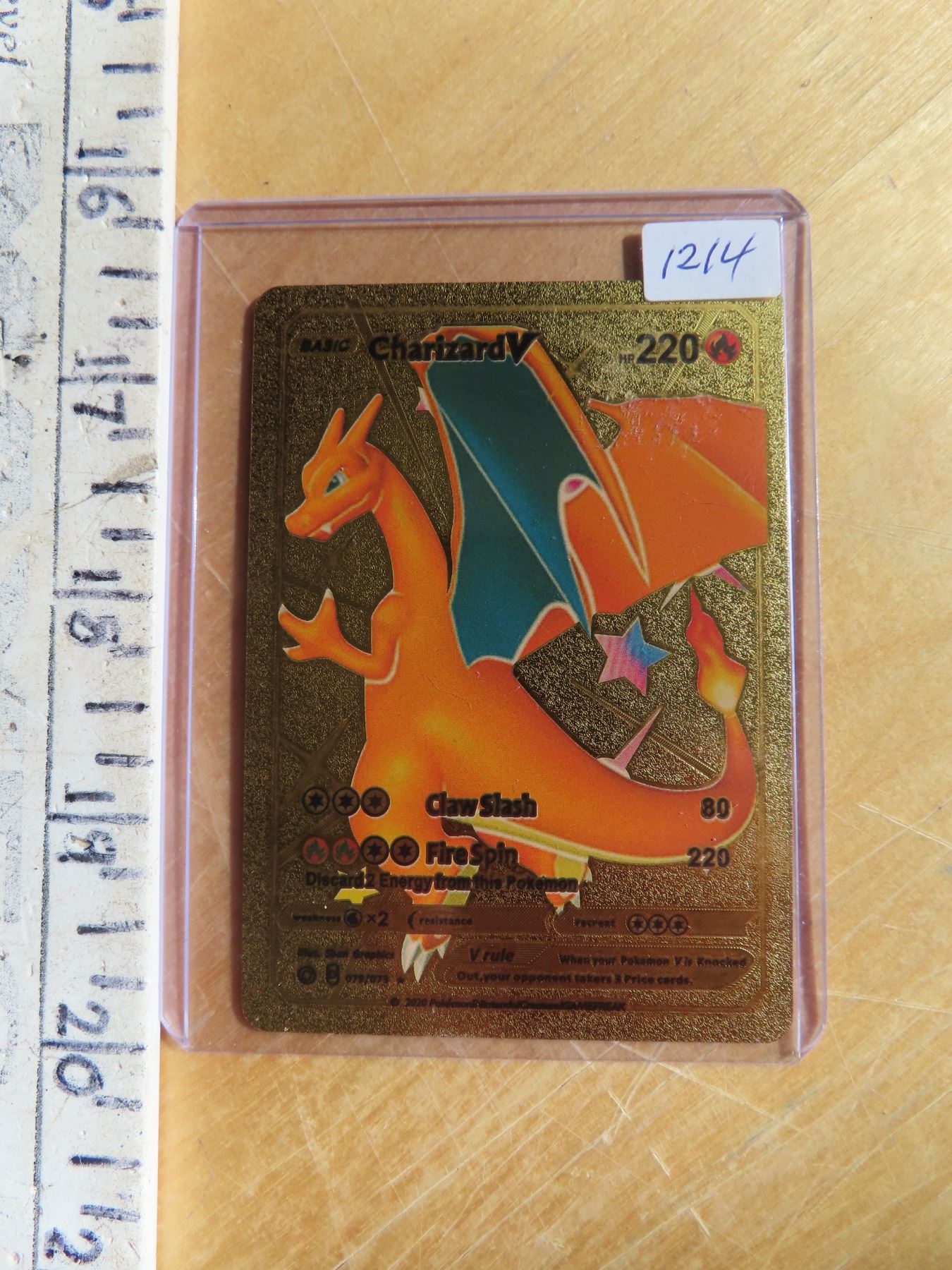 Charizard V gold metal Pokmon card - Schmalz Auctions Charizard V gold metal Pokmon card - Schmalz Auctions