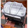 Image 1 : NEWLY ASSEMBLED BABY CRIB ON CASTORS W/ BUG NET