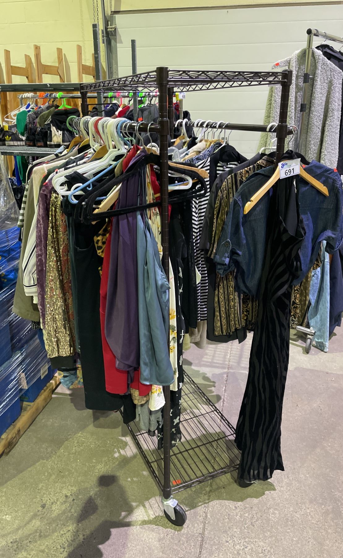 RACK OF ASSORTED CLOTHING (RACK NOT INCLUDED) - Able Auctions