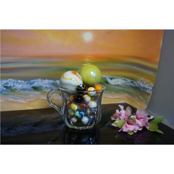 Glass cup with vintage marbles
