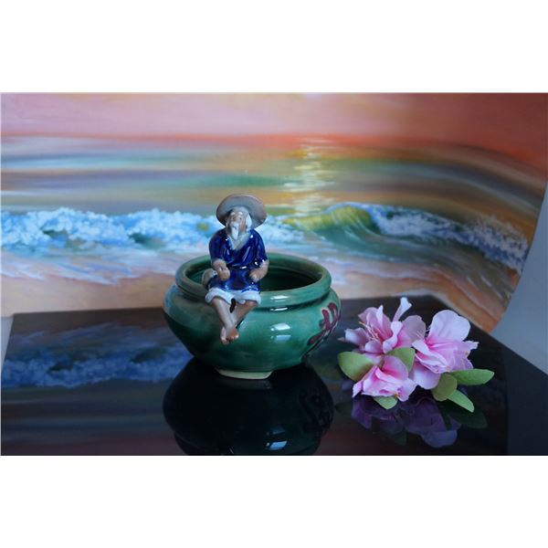 Vintage ceramic planter with fisherman