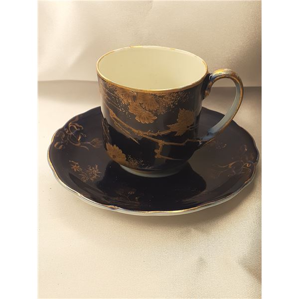 Vintage porcelain chocolate teacup and saucer