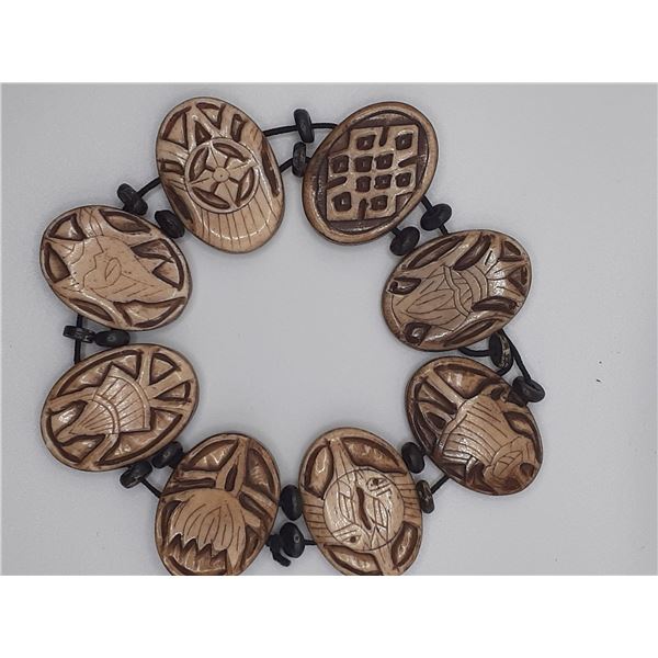 Vintage Stretched bracelet, bone hand carving with symbols