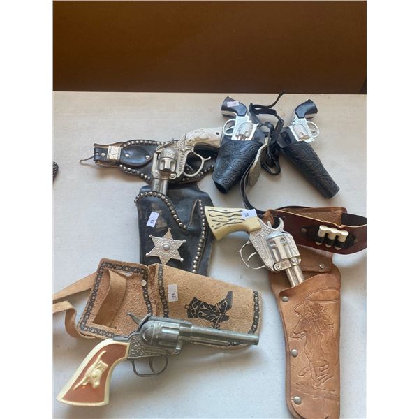 Assortment Of Western Style Capguns With Leather holsters