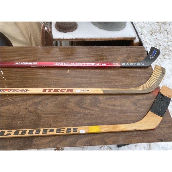 Set Of Three Hockey Sticks