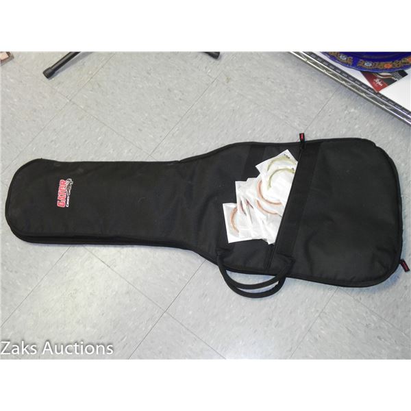 Gator Guitar Case with 9 Pkgs of Strings