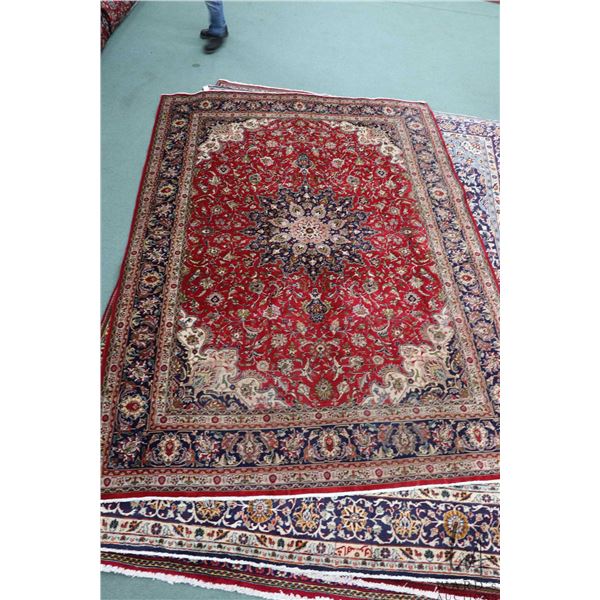 100% hand made Iranian wool carpet "Tabriz" with center medallion, red background and highlights of