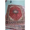 Image 1 : 100% hand made Iranian wool carpet "Tabriz" with center medallion, red background and highlights of