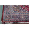 Image 2 : 100% hand made Iranian wool carpet "Mashad" with center medallion with cranberry background, overall