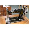 Image 2 : Antique treadle Peerless sewing machine in oak cabinet