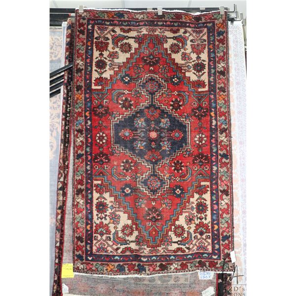 100% hand made Iranian wool carpet "Zanjan" with center medallion, red background and highlights of 