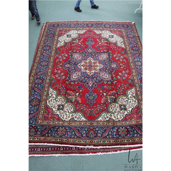 100% hand made Iranian wool carpet "Tabriz" with center medallion, bright red background and vibrant