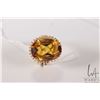 Image 1 : 14kt yellow gold ring set with 18mm X 13mm tests as oval yellow topaz gemstone, size 7.5