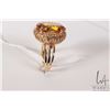 Image 2 : 14kt yellow gold ring set with 18mm X 13mm tests as oval yellow topaz gemstone, size 7.5