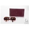 Image 1 : Cartier leather wallet and a pair of Cartier sunglasses