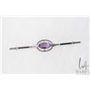 Image 1 : 18kt white gold and amethyst gemstone bar pin