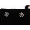 Image 1 : Pair of 14kt white gold and diamond solitaire studs each surrounded by eight point diamond enhancers