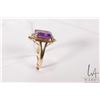 Image 2 : 14kt yellow gold ring set with emerald cut amethyst gemstone and two small accent diamonds, size 6.7