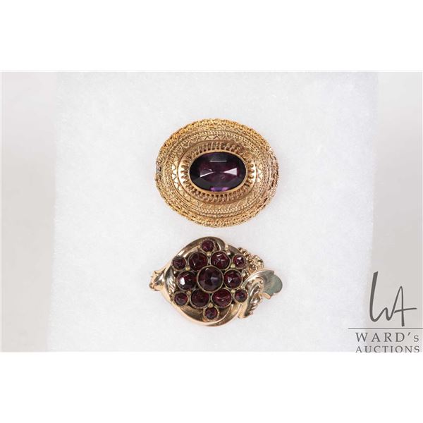 Two antique brooches including garnet set with purple amethyst like gemstone, tests gold