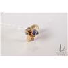 Image 1 : 18kt yellow gold ring set with .60ct pear shaped tanzanite and .21cts of round full cut diamonds. Re