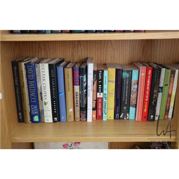 Selection of soft and hardcover novels including Pearl S. Buck, Deepak Chopra, Robert Louis Stevenso