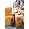 Image 1 : Three hand made musical instruments including a 50" long Didgerdoo with snake and lizard decoration,