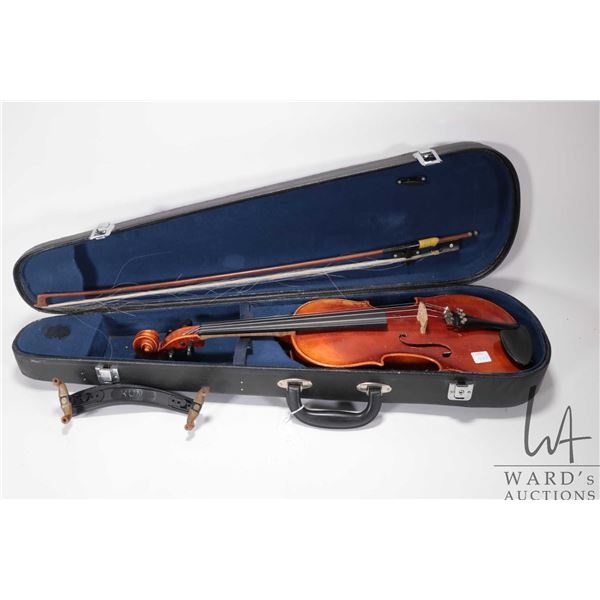 Violin marked " Copy of Stradivarus" Made in German 23 1/4", includes bow and fitted hard case