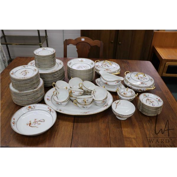 Large set of Limoges china tableware including eleven 9 1/2" plates, twelve 7 1/2" plates, eleven 6"