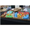 Image 1 : Two trays with a large selection of Fisher Price Little People including Firehose/ market/ post offi