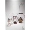 Image 1 : Four antique oil lamps including two colourless glass with chimneys, red barn lamp and bas relief br