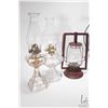 Image 2 : Four antique oil lamps including two colourless glass with chimneys, red barn lamp and bas relief br