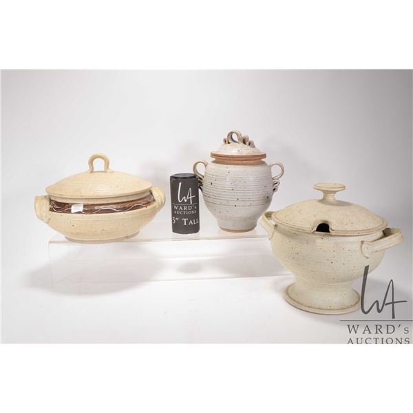 Three pieces of handmade pottery including pedestal tureen plus double handled casserole and biscuit